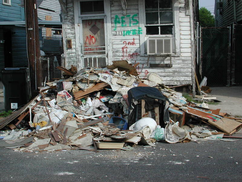 Large household rubbish pile stacked on a residential street awaiting removal — the scale of clearance work Pete’s team handles