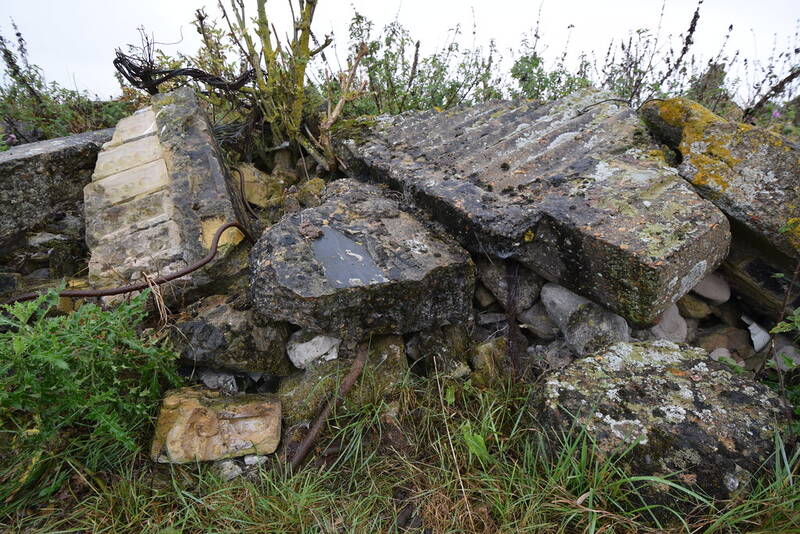 Broken concrete and brick demolition rubble — the hardfill material this skip takes