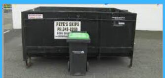 Black 4.5 cubic metre skip bin with PETE’S SKIPS signage hired out by Christchurch Skip Hire