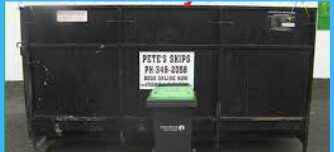Black 7 cubic metre skip bin with a green-lidded wheelie bin alongside, hired out by Christchurch Skip Hire